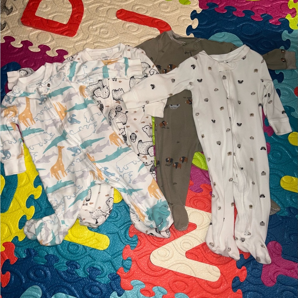 Carters footies pajama. Comes with ALL 4 for the price